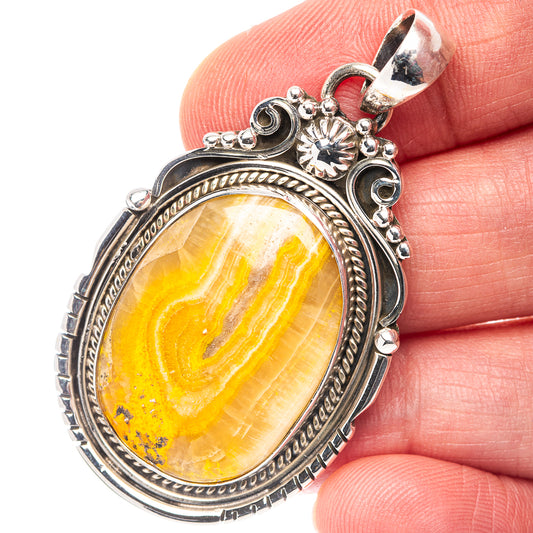 Bumblebee Jasper oval pendant in .925 sterling silver with ornate bezel and loop bail