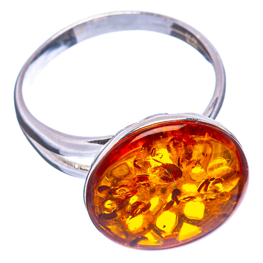 Adjustable .925 sterling silver ring with oval amber cabochon in bezel setting