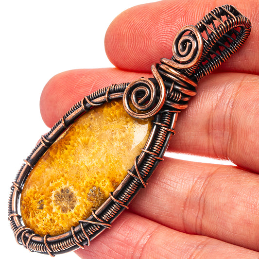 Oxidized copper wire wrap pendant with oval amber teardrop stone, spiral ends