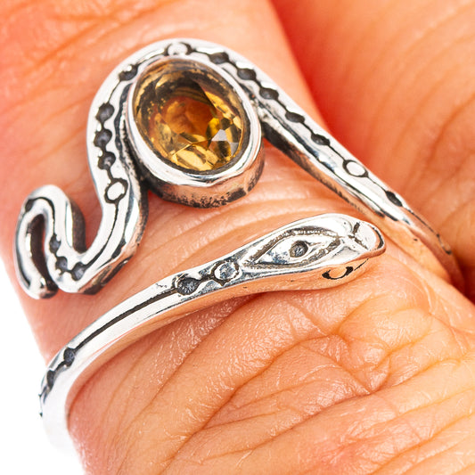 Adjustable .925 sterling silver snake ring with oval citrine gemstone and filigree details