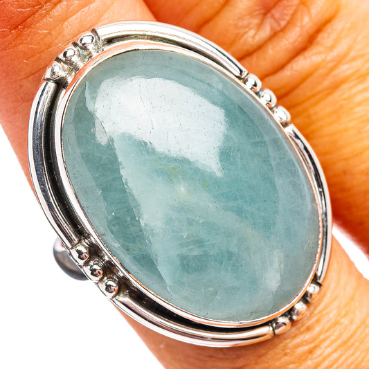Size 8 oval aquamarine ring in .925 sterling silver with bezel and small side stones