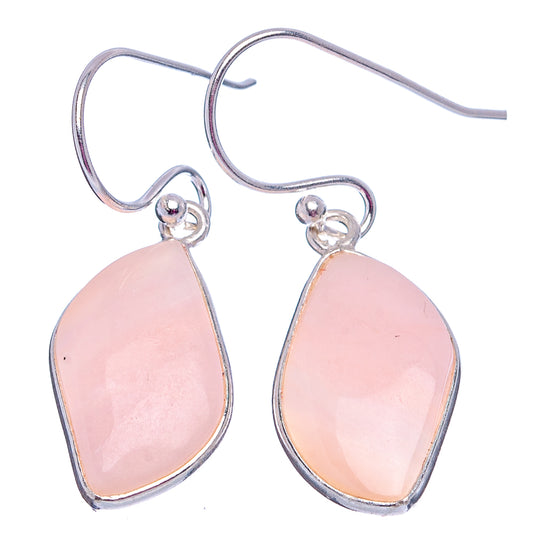 Sterling silver teardrop opal drop earrings with pink cabochon, hanging front view