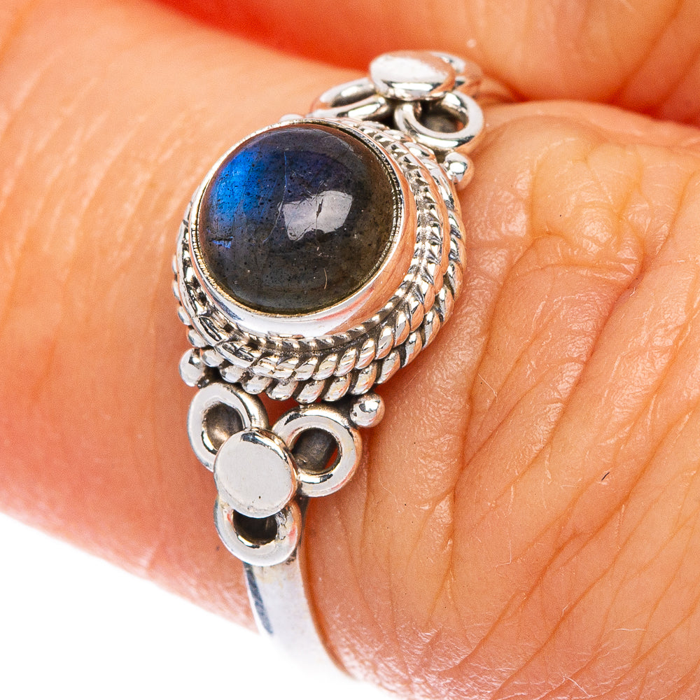 Dainty sterling silver labradorite ring with oval dark-blue cabochon and braided bezel