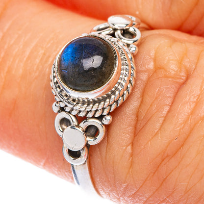 Dainty sterling silver labradorite ring with oval dark-blue cabochon and braided bezel