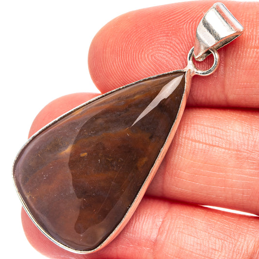 Red jasper teardrop pendant with silver-plated bail and polished stone face