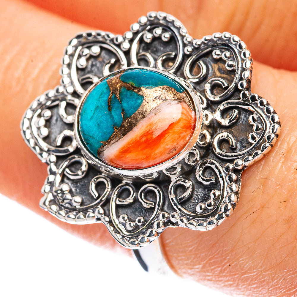 Turquoise flower ring with orange-red stone, ornate silver filigree setting