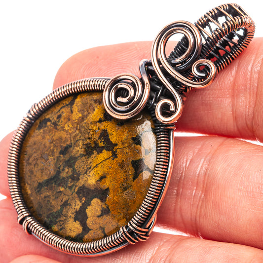 Oxidized copper wire-wrap pendant with teardrop yellow-brown agate and round loops