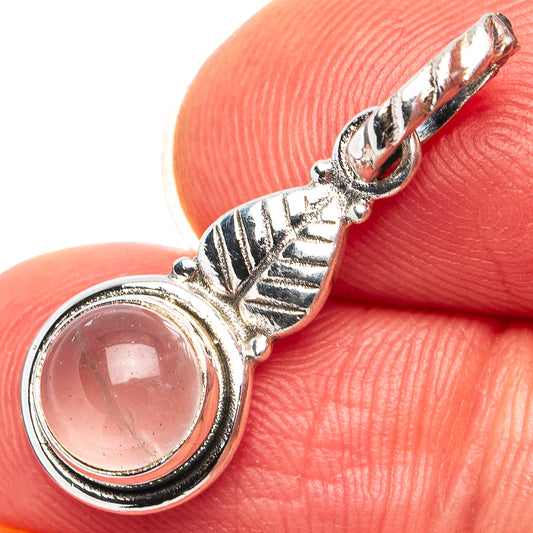 Sterling silver rose quartz dainty pendant with round pink cabochon and decorative bail