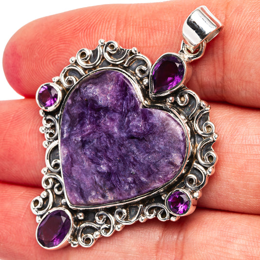 Heart amethyst pendant with carved .925 sterling silver border and teardrop purple stones.