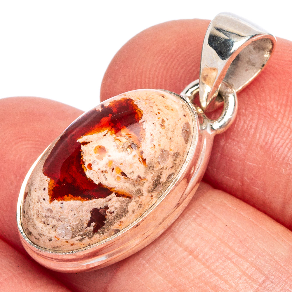 Oval fire opal pendant set in polished 925 sterling silver bezel