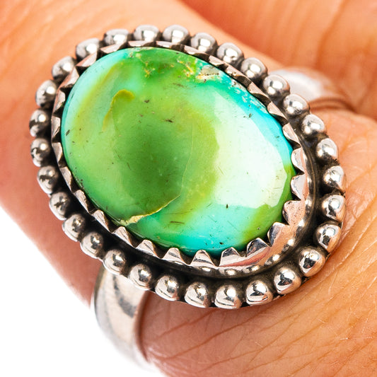 Silver ring with oval turquoise cabochon set in a beaded bezel