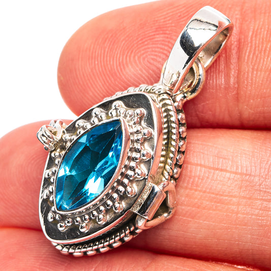 Oval blue topaz poison pendant in .925 sterling silver, ornate bezel and bail