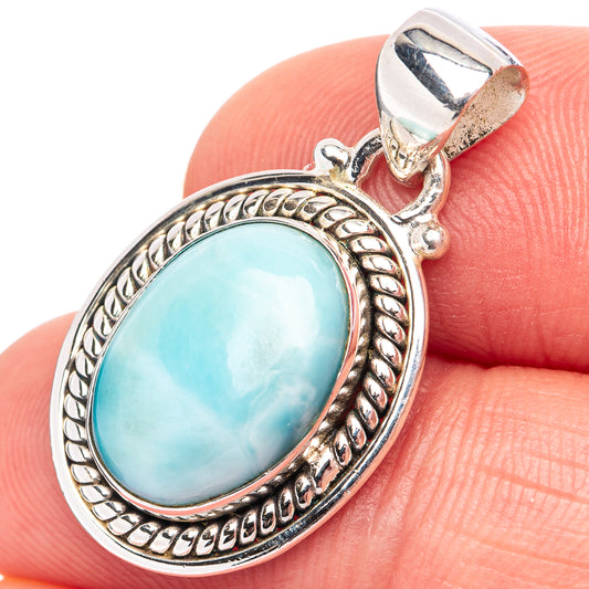 Oval larimar gemstone pendant in .925 sterling silver with raised beaded frame and bail