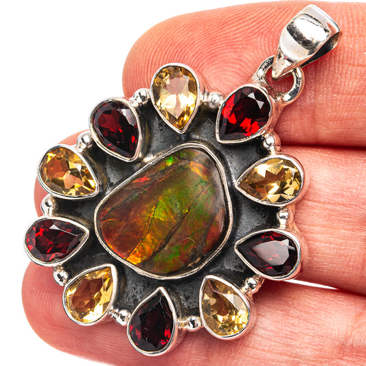 Iridescent green-red cabochon pendant with red and yellow gemstone accents, silver setting