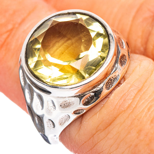 Sterling silver lemon quartz ring with textured band and large oval yellow gemstone