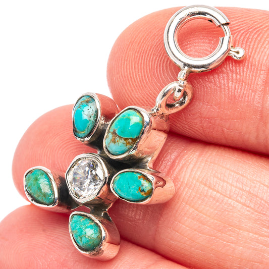 Sterling silver turtle pendant with turquoise cabochons and clear center stone