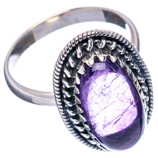Sterling silver amethyst ring with oval purple gemstone and ornate bezel, size 7