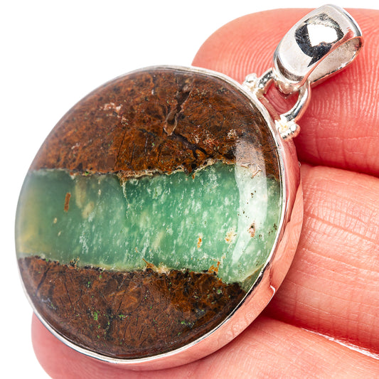 Sterling silver chrysoprase pendant with round green stone cabochon in bezel and bail