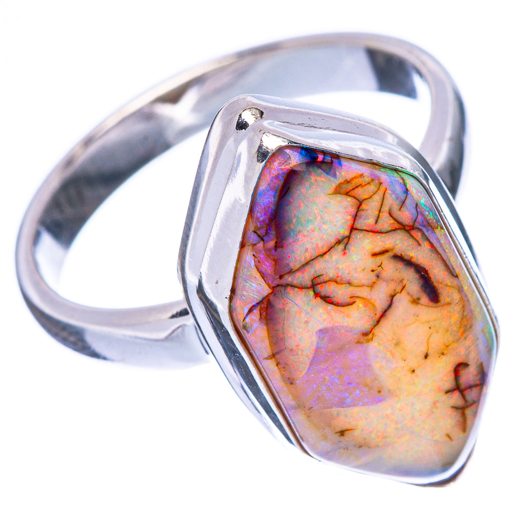 Sterling silver opal ring with faceted pear-shaped iridescent stone, side view