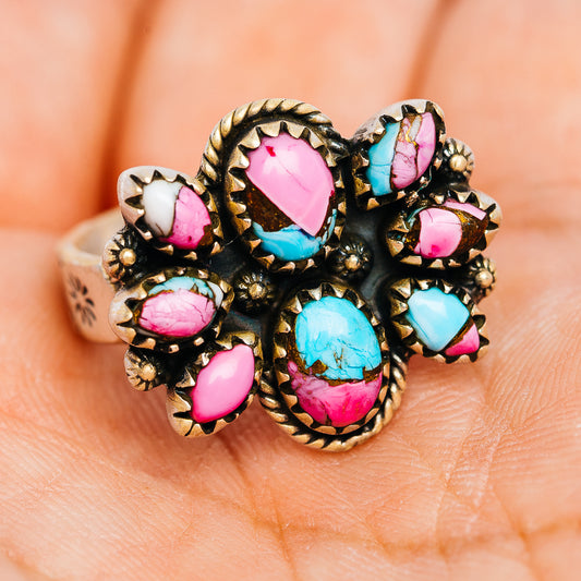 Southwestern turquoise and pink oval stone cluster ring with ornate .925 sterling silver band