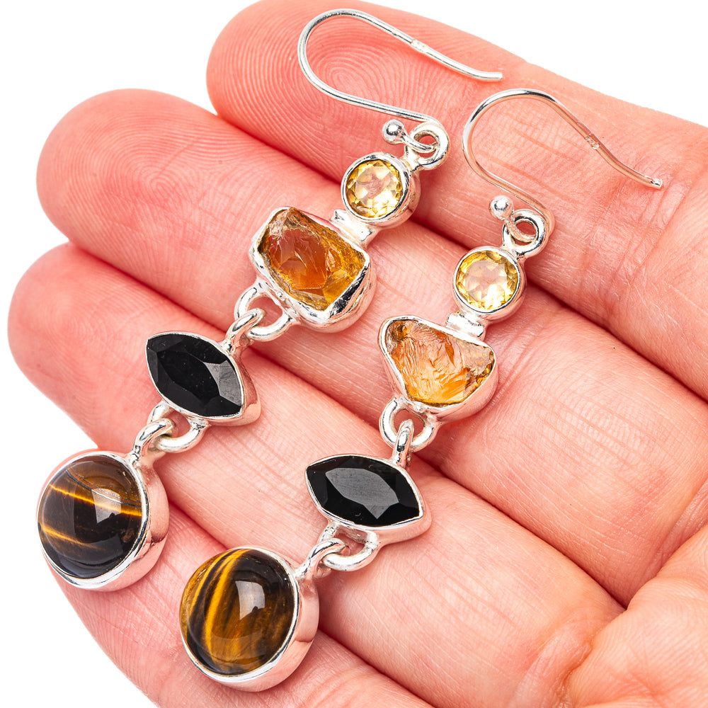 Sterling silver drop earrings with citrine, black onyx, and tiger eye stone charms