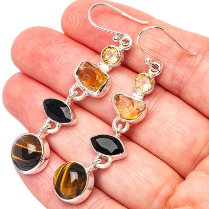 Sterling silver drop earrings with citrine, black onyx, and tiger eye stone charms