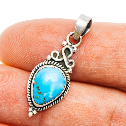 Turquoise teardrop pendant in .925 sterling silver with ornate bezel detail