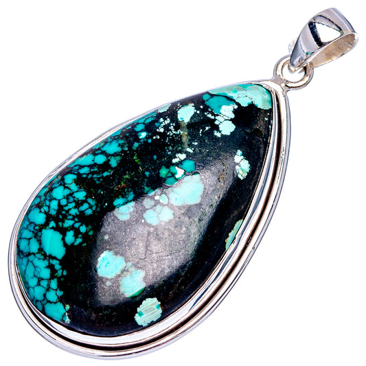 925 sterling silver turquoise teardrop pendant with turquoise on black stone surface