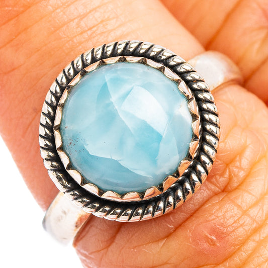 Larimar ring with round light-blue cabochon and rope-texture silver frame