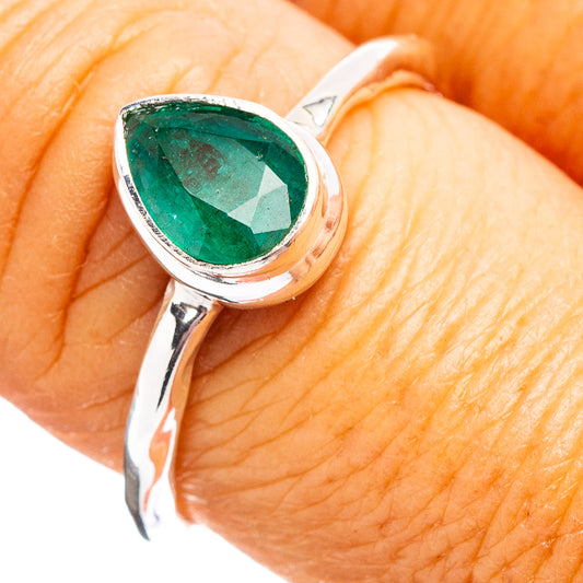 Sterling silver ring with green pear-cut emerald-like gemstone on slim band