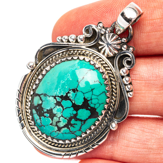 Oval turquoise pendant in .925 sterling silver, ornate bezel with loop bail