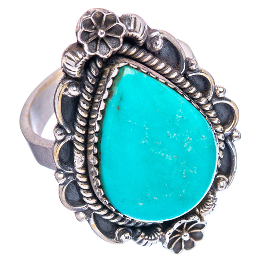 Turquoise teardrop sterling silver ring with ornate floral bezel and split shank