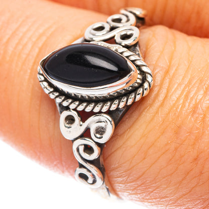 Sterling silver ring with black oval onyx stone and ornate bezel details