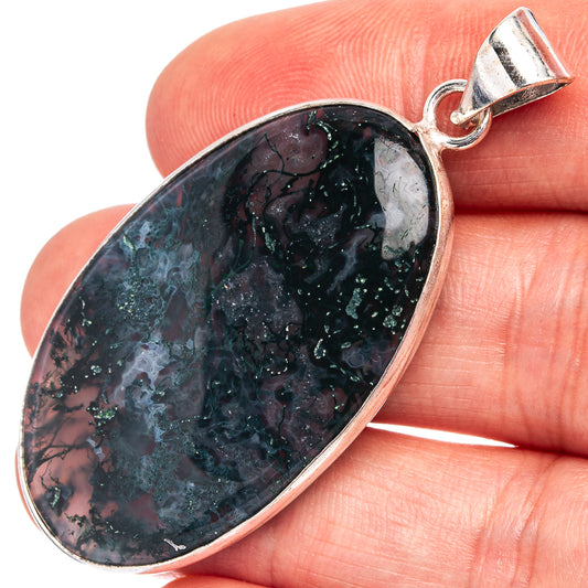 Oval moss agate pendant with silver-plated bezel, dark green and black swirls.