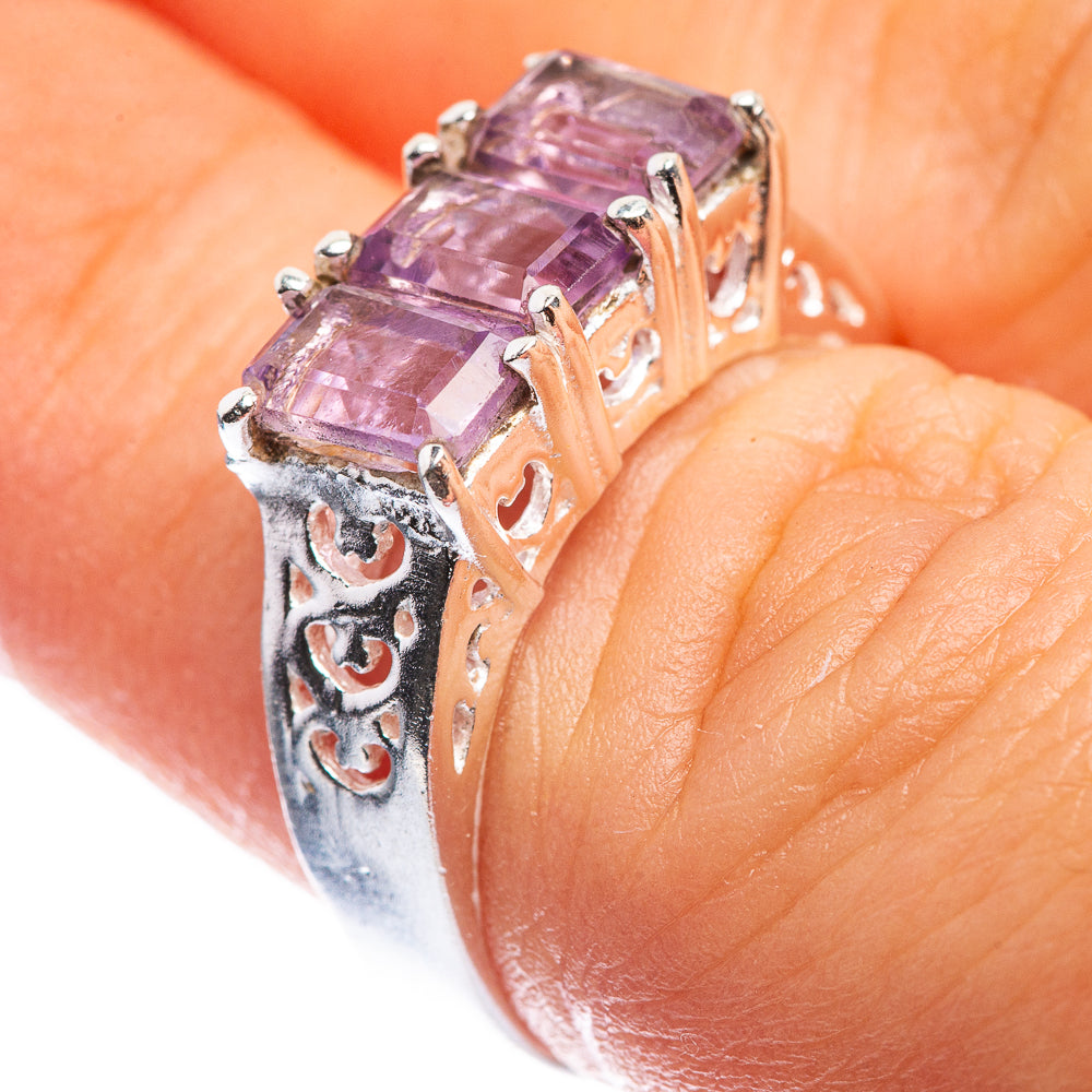 Sterling silver amethyst ring with faceted square stone and decorative side cutouts
