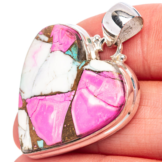 Sterling silver heart pendant with pink and turquoise stone inlay on white background