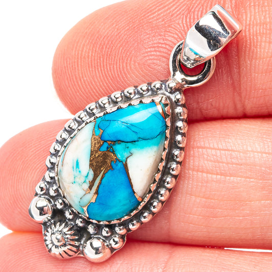 Turquoise teardrop pendant with .925 silver ornate border and bail, close-up