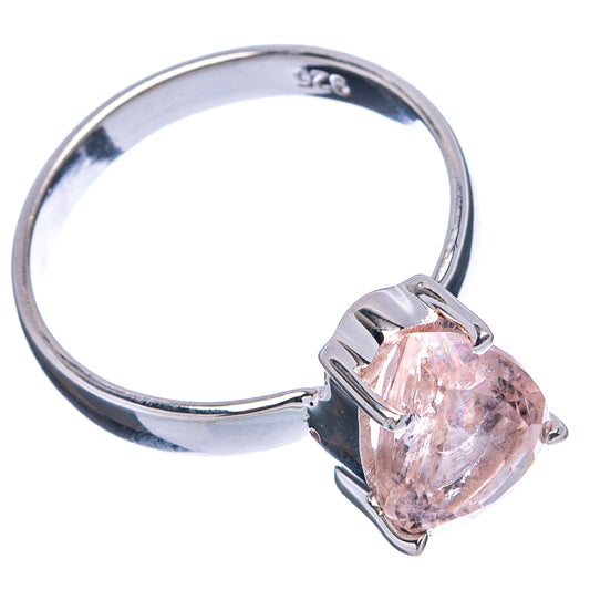 Sterling silver ring with light pink pear-cut morganite and raised prongs, side view