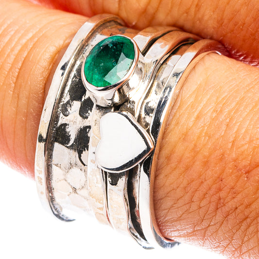 Sterling silver ring with green oval emerald centerpiece and openwork band