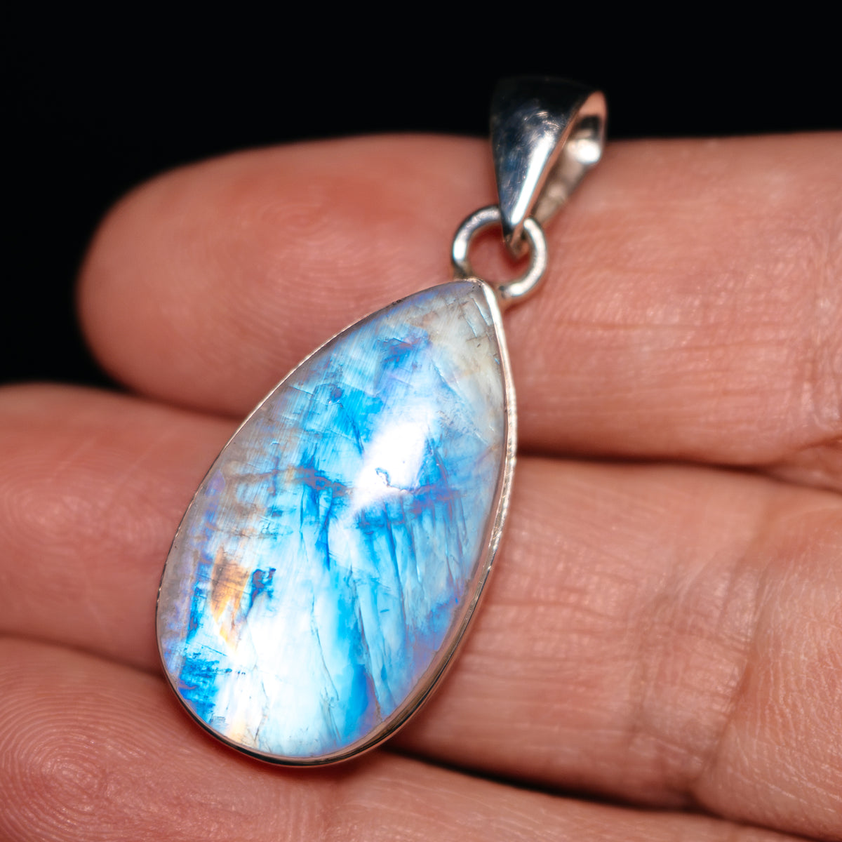Sterling silver moonstone pendant, teardrop bezel with blue iridescent flash