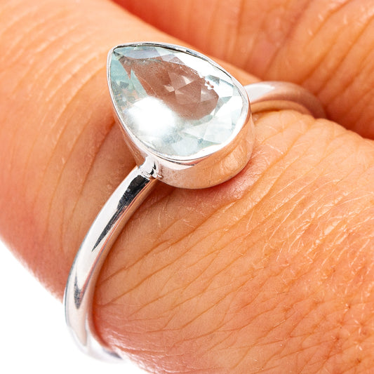 Sterling silver ring with faceted light blue aquamarine teardrop gemstone