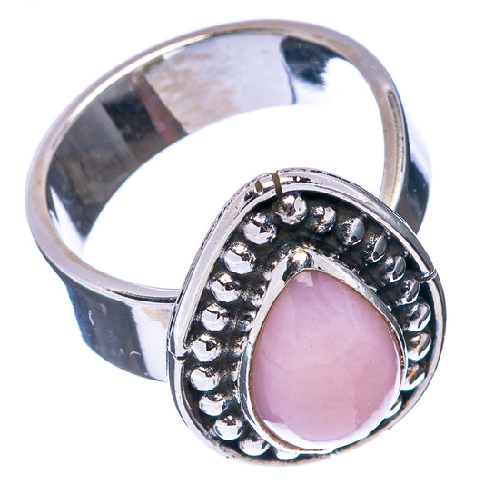 Sterling silver ring with pink teardrop opal set in bead-edged oval frame