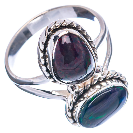 Sterling silver ring with two oval black opal gemstones in raised ornate settings