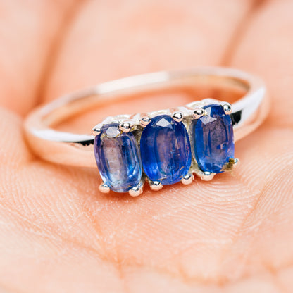 Side view of 3-stone kyanite ring in .925 sterling silver with three blue gemstones
