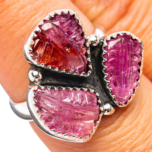 Sterling silver carved ruby ring with three oval purple stones in serrated prong setting