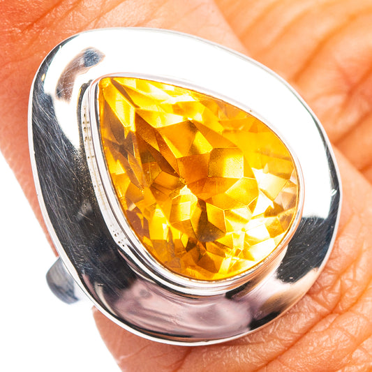 Sterling silver ring with large faceted teardrop citrine gemstone, polished bezel