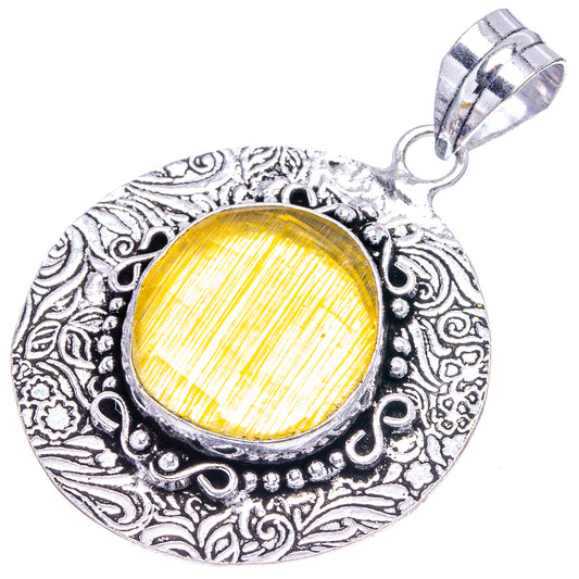 German silver pendant with yellow cabochon, ornate filigree border, top bail