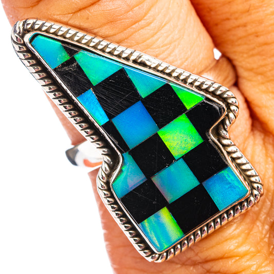 Silver lightning-bolt ring with black onyx center and iridescent green-blue checker pattern