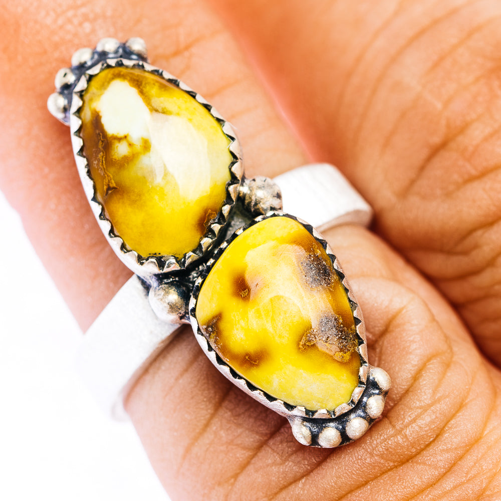 Adjustable sterling silver ring with two bezel-set oval yellow stones