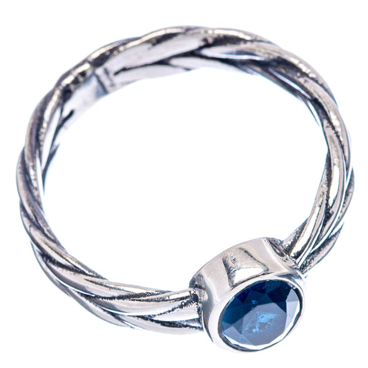 Sterling silver twisted dainty ring with bezel-set dark blue gemstone, open view